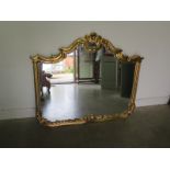 A large gilt ornate mirror - 114cm x 136cm