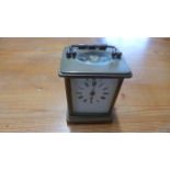 A brass and five glass carriage clock,