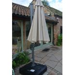 A Bramblecrest ex display telescopic parasol with a water filled base - RRP £550