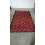 A hand knotted woolen Turkman rug - 2.07m x 1.