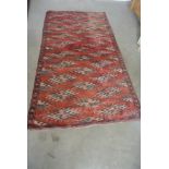 A hand knotted woolen Turkman rug - 2.03m x 1.