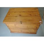 A rustic 19th century stripped pine box on castors - Height 56cm x 75cm x 50cm