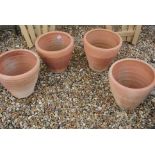 A set of four terracotta plant pots - Height 28cm