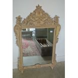 A large ornate Victorian style mirror sold by Macys of New York - 119cm x 74cm