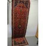 A hand knotted woolen Hamadan rug - 3.20m x 0.