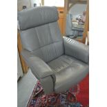 A grey leather revolving swivel armchair - as new,