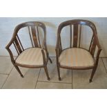 A pair of Edwardian mahogany and inlaid tub chairs