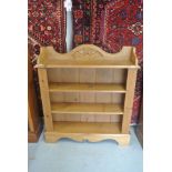 A pine bookcase with reeded panels to front and with upstand featuring carved acorns - Height 107cm