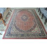 A hand knotted woolen Isfhan rug - wear to corner and to edges - 345cm x 197cm