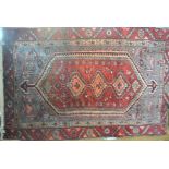 A hand knotted woolen Hamadan rug - 1.75m x 1.