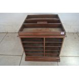 A mahogany revolving filing set of double sided shelves - 58cm tall,