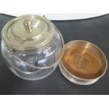 A glass ovoid form biscuit barrel with hallmarked silver top and a hallmarked silver bottle coaster