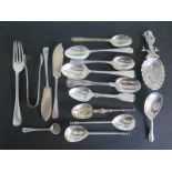 An assortment of hallmarked silver spoons, forks and knives,