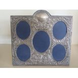 A large hallmarked silver photo/picture frame with five oval apertures,