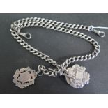 A hallmarked silver Albert watch chain with T bar and silver medallions - clasp to one end damaged