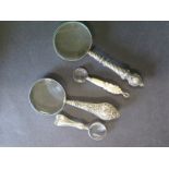 Four small magnifying glasses one hallmarked silver and one with a bone handle - Length 7cm