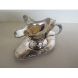 A silver hallmarked sauce boat with twin handles on tray, Chester 1907/08 - approx weight 6.