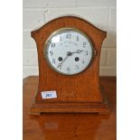 A 19th Century oak case French Mantle Clock - strikes hours on gong - 8 day movement - Arabic