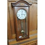 A modern Hermle chiming wall clock - clean condition - working in saleroom - 63cm tall