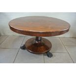 A 19th Century rosewood breakfast dining table with a 122cm (4ft) top raised on a platform base -