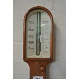 A 19th Century oak stick barometer with an ivory dial - signed Negretti and Zambra over a