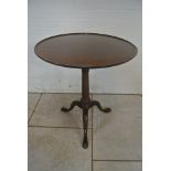 A 19th Century mahogany tilt top sidetable with a dish top and birdcage action