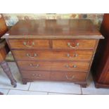 A Georgian mahogany chest with two short over three long drawers with brass swan neck handles -