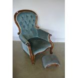 A 19th Century mahogany spoon back armchair and a footstool in blue draylon