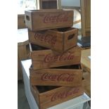 A set of five corresponding Coca Cola storage trays