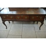 An 18th Century oak dresser with three drawers on Cobriolle legs - 171cm wide and 75cm high x 48cm