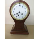 An Edwardian mahogany and inlaid balloon shaped mantle clock - 30cm high - striking on a gong with