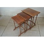 A nest of three rosewood side tables