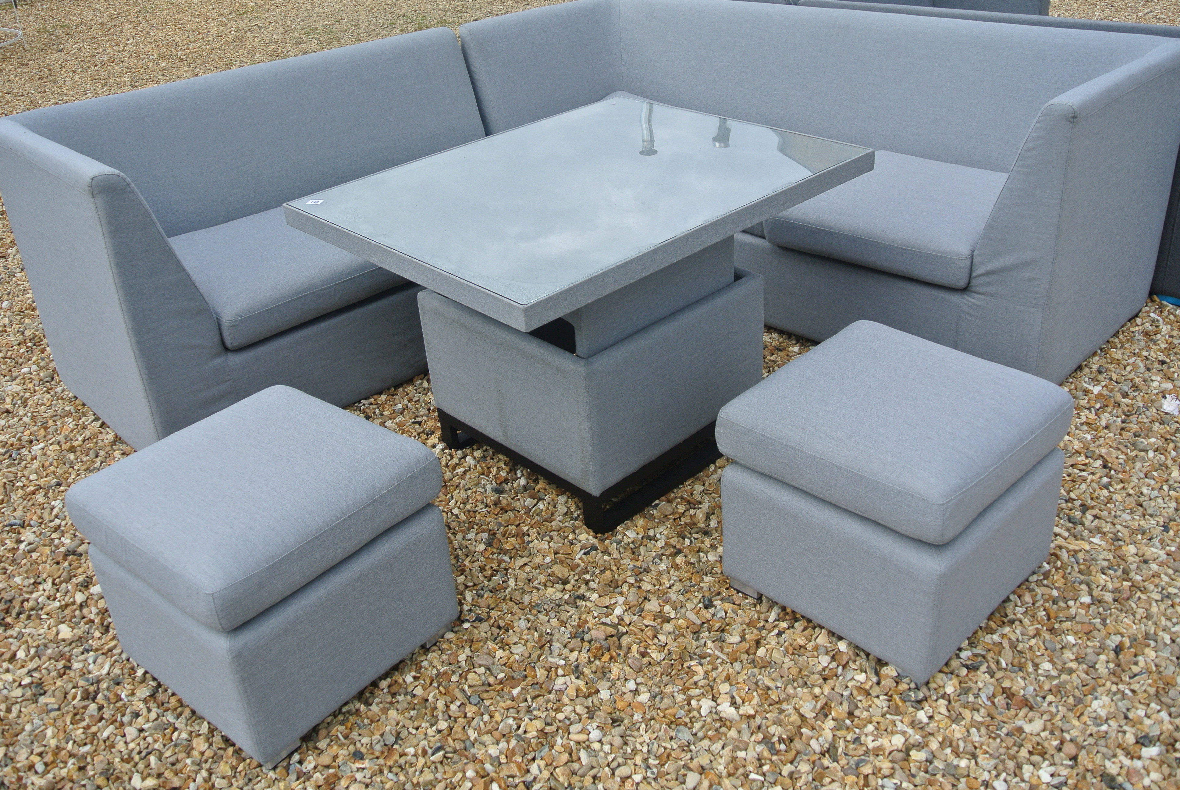 A Bramblecrest all weather Molly Modular sofa with mini adjustable casual dining table and two