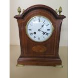 An Edwardian mahogany and inlaid striking mantle clock with key and pendulum - 28cm high - in