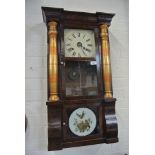 An American mahogany wallclock - 82cm tall x 47cm wide with pendulum and weights