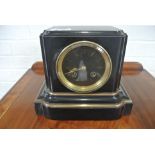 A small 19th Century marble striking mantle clock striking on a bell - in working order - 20cm high