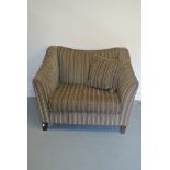 A Snugler Armchair purchased from John Lewis - good condition apart from a loose back leg