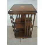 A mahogany revolving bookcase with an inlaid top