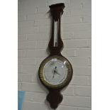 A 19th Century French barometer with a thermometer over a porcelain dial - signed Chevallier Paris