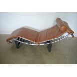 A Le Corbusier style day bed in brown leather and chrome on black metal support - minor wear to