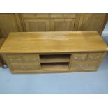 A modern TV cabinet in oak with six drawers - 146cm wide x 52cm high