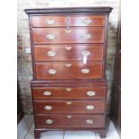 A Georgian mahogany and crossbanded chest on chest with oak lined drawers canted corners and a