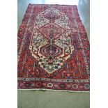 A hand knotted Persian Hamadan rug - 2.24m x 1.