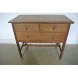 An Arts and Crafts Oak Hall Chest - possibly Arthur Simpson - with a carved frieze above two short