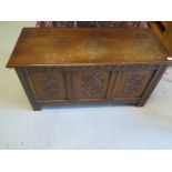 An oak blanket box with a carved front - 57 cm tall x 106 cm x 46 cm