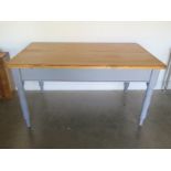 A pine table with a single end drawer and a painted base and legs - 153cm x Width 91cm x Height