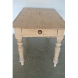 A 19th/20th Century Pine Table with a Single Drawer on Turned legs - measuring 130 cm x 78 cm