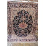 A hand knotted Persian Kirman rug - 2.85m x 2.