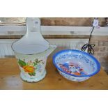 An enamel kitchen bucket with pouring sprout and slot for hanging decorated with painted flowers -