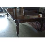 A good quality 19th Century mahogany restored pull out dining table with three leaves on five